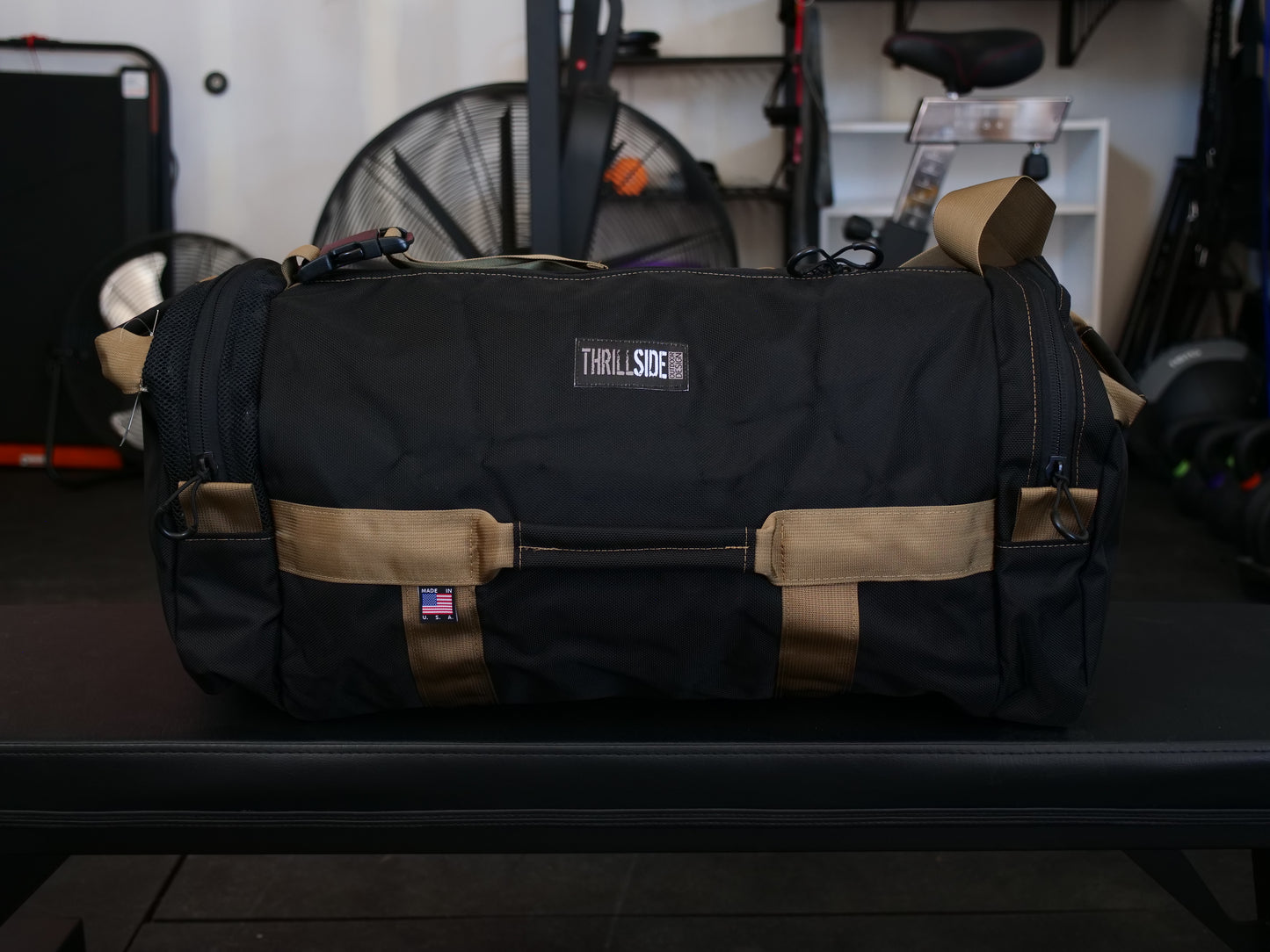 Black and Coyote Tan Burner Bag duffel with garage gym background
